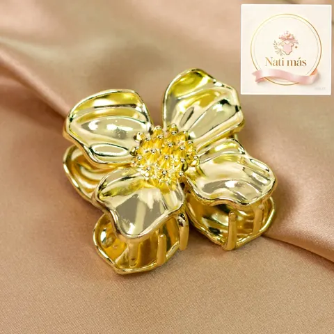 Pinza para pelo flor dorada con centro brillante